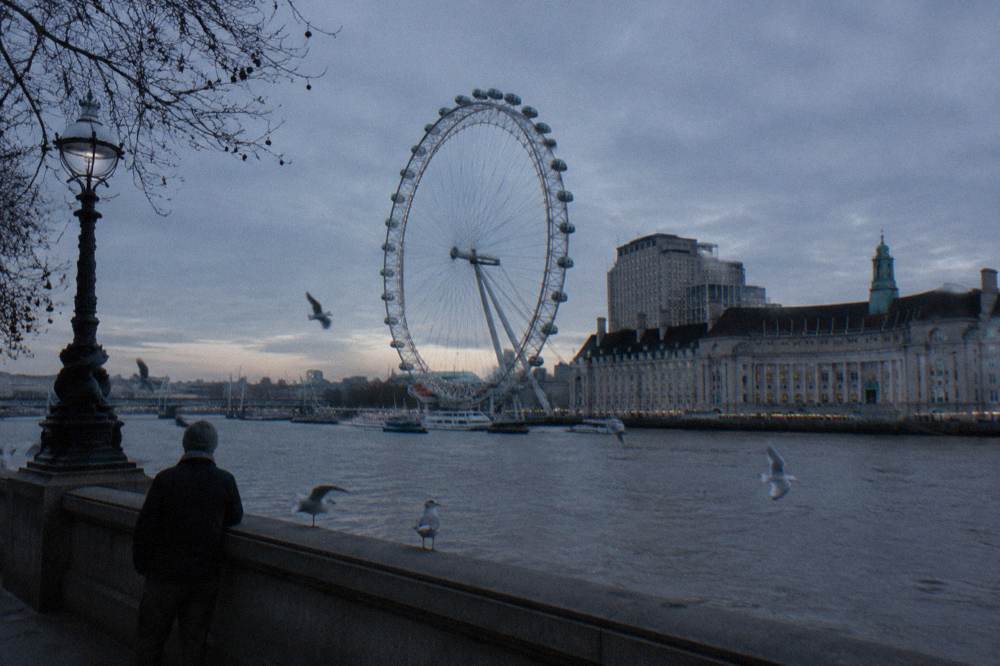 The Thames at winter dusk with the London skyline in cold light
