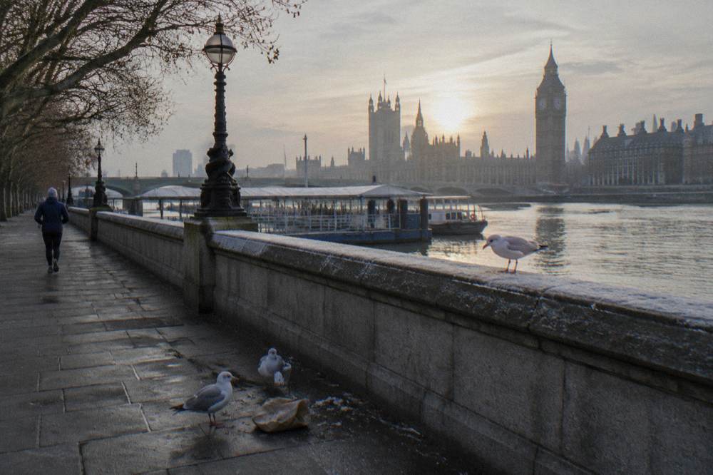 An empty riverside promenade in London on a quiet winter morning